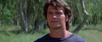 Movie still from “Road House” (1989), directed by Rowdy Herrington – A person with long hair; Close Up shot, Low angle