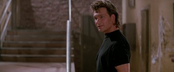 Movie still from “Road House” (1989), directed by Rowdy Herrington – Patrick swayze in a scene from dirty dancing; Close Up shot, Low angle