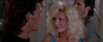 Movie still from “Road House” (1989), directed by Rowdy Herrington – A man and a woman talking to each other; Close Up shot, Over the shoulder angle