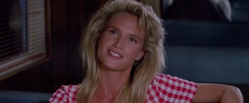 Movie still from “Road House” (1989), directed by Rowdy Herrington – A person with long blonde hair; Close Up shot, Low angle
