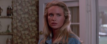 Movie still from “Road House” (1989), directed by Rowdy Herrington – A person with long blonde hair; Close Up shot, Over the shoulder angle