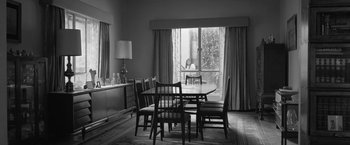 Movie still from “Roma” (2018), directed by Alfonso Cuarón – A black and white photo of a dining room table; Wide shot, High angle
