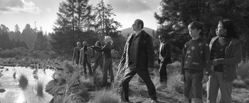 Movie still from “Roma” (2018), directed by Alfonso Cuarón – A black and white photo of a group of people in a field; Wide shot, Low angle