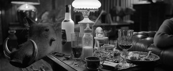Movie still from “Roma” (2018), directed by Alfonso Cuarón – A table with a lamp and a lot of stuff on it; Extreme Close Up shot, High angle