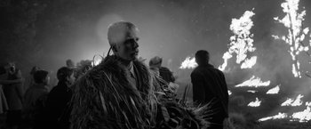 Movie still from “Roma” (2018), directed by Alfonso Cuarón – A man in a fur coat standing in front of a crowd; Medium shot, Over the shoulder angle