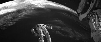 Movie still from “Roma” (2018), directed by Alfonso Cuarón – An image of an astronaut in the outer space; Wide shot, Overhead angle