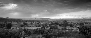 Movie still from “Roma” (2018), directed by Alfonso Cuarón – A black and white photo of a desert landscape; Extreme Wide shot, Low angle