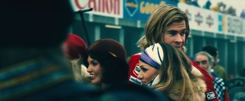 Movie still from “Rush” (2013), directed by Ron Howard – A group of people standing next to each other on the street; Close Up shot, Low angle