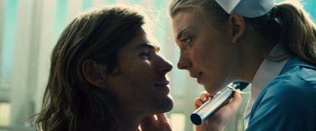Movie still from “Rush” (2013), directed by Ron Howard – A man and a woman looking into each others eyes; Close Up shot, Low angle