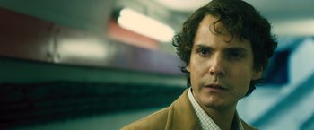 Movie still from “Rush” (2013), directed by Ron Howard – A person with curly hair; Close Up shot, Low angle