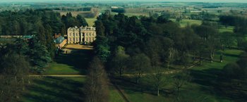 Movie still from “Rush” (2013), directed by Ron Howard – An aerial view of a castle surrounded by trees; Extreme Wide shot, High angle