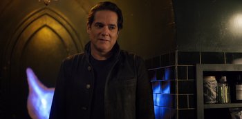 Movie still from “Russian Doll” (2019), created by Natasha Lyonne – A man standing in front of a tiled wall; Close Up shot, Over the shoulder angle