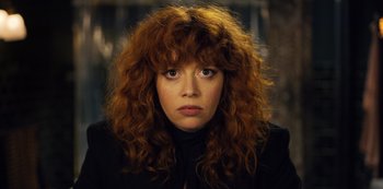 Movie still from “Russian Doll” (2019), created by Natasha Lyonne – A person with curly red hair; Close Up shot, Low angle