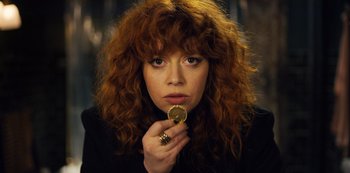 Movie still from “Russian Doll” (2019), created by Natasha Lyonne – A person holding a coin in her hand; Close Up shot, High angle