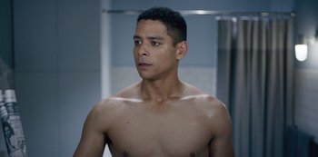 Movie still from “Russian Doll” (2019), created by Natasha Lyonne – A man with no shirt is standing in a bathroom; Close Up shot, High angle