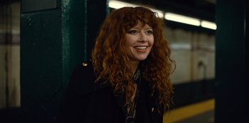 Movie still from “Russian Doll” (2019), created by Natasha Lyonne – A person with curly red hair; Close Up shot, High angle