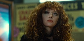 Movie still from “Russian Doll” (2019), created by Natasha Lyonne – A person with curly red hair; Close Up shot, Low angle