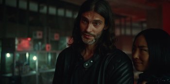 Movie still from “Russian Doll” (2019), created by Natasha Lyonne – A person with long black hair; Close Up shot, Over the shoulder angle