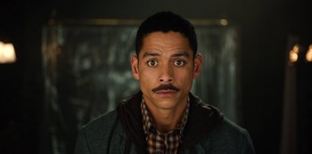 Movie still from “Russian Doll” (2019), created by Natasha Lyonne – A person with a mustache; Close Up shot, High angle