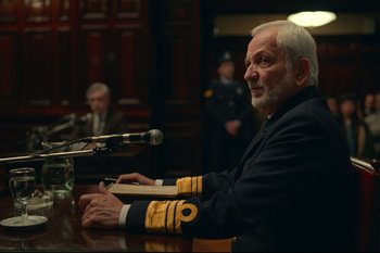 Movie still from “Argentina, 1985” (2022), directed by Santiago Mitre – An older man in a military uniform sitting at a table; Close Up shot, Over the shoulder angle