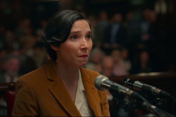 Movie still from “Argentina, 1985” (2022), directed by Santiago Mitre – A woman is speaking into a microphone in front of a crowd; Close Up shot, Over the shoulder angle