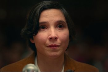 Movie still from “Argentina, 1985” (2022), directed by Santiago Mitre – A person with a microphone; Close Up shot, Over the shoulder angle