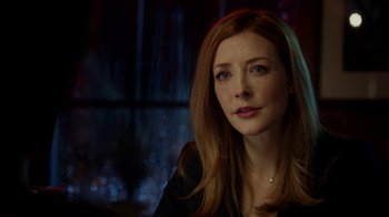 Movie still from “Salvation” (2017), created by Elizabeth Kruger – A person with long red hair; Close Up shot, Over the shoulder angle