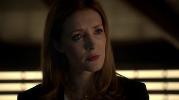 Movie still from “Salvation” (2017), created by Elizabeth Kruger – A person with long red hair; Close Up shot, Over the shoulder angle