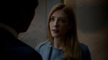 Movie still from “Salvation” (2017), created by Elizabeth Kruger – A woman in a blue dress is talking to someone; Close Up shot, Over the shoulder angle