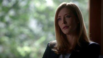 Movie still from “Salvation” (2017), created by Elizabeth Kruger – A woman with long blonde hair wearing a black jacket; Close Up shot, Over the shoulder angle