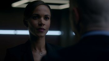 Movie still from “Salvation” (2017), created by Elizabeth Kruger – A woman looking at a man in a suit; Close Up shot, Over the shoulder angle