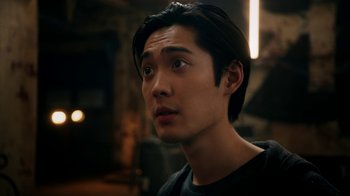 Movie still from “Salvation” (2017), created by Elizabeth Kruger – A person with long black hair; Close Up shot, Low angle