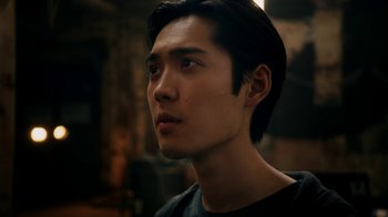 Movie still from “Salvation” (2017), created by Elizabeth Kruger – A person looking up at something; Close Up shot, Low angle