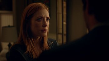 Movie still from “Salvation” (2017), created by Elizabeth Kruger – A person sitting in front of another person; Close Up shot, Over the shoulder angle