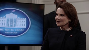 Movie still from “Salvation” (2017), created by Elizabeth Kruger – A person in front of a tv; Close Up shot, Over the shoulder angle