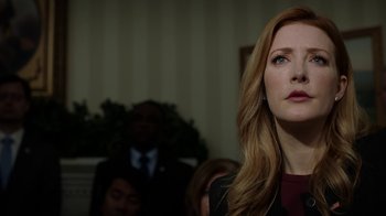 Movie still from “Salvation” (2017), created by Elizabeth Kruger – A person with long red hair; Close Up shot, Low angle