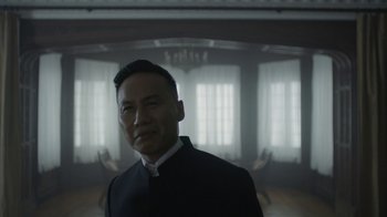 Movie still from “Mr. Robot” (2015), created by Sam Esmail – A man wearing a suit and tie standing in a room; Close Up shot, Low angle