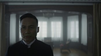 Movie still from “Mr. Robot” (2015), created by Sam Esmail – A man wearing a priest's outfit standing in front of a window; Close Up shot, Low angle