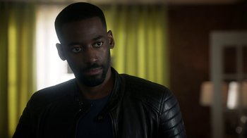 Movie still from “Salvation” (2017), created by Elizabeth Kruger – A person wearing a leather jacket; Close Up shot, Over the shoulder angle