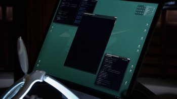 Movie still from “Salvation” (2017), created by Elizabeth Kruger – A computer screen with a lot of black text on it; Extreme Close Up shot, Over the shoulder angle