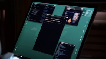 Movie still from “Salvation” (2017), created by Elizabeth Kruger – A computer screen with a bunch of computer screens on it; Extreme Close Up shot, High angle