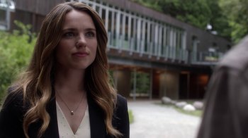 Movie still from “Salvation” (2017), created by Elizabeth Kruger – A beautiful young lady wearing a black jacket; Close Up shot, Over the shoulder angle