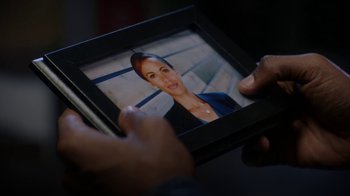 Movie still from “Salvation” (2017), created by Elizabeth Kruger – A picture of a woman in a black frame; Close Up shot, Over the shoulder angle