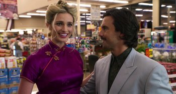 Movie still from “Sandy Wexler” (2017), directed by Steven Brill – A man and a woman smiling for the camera; Close Up shot, Over the shoulder angle
