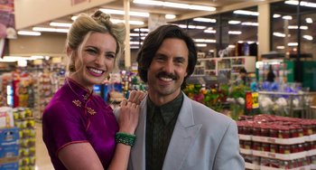 Movie still from “Sandy Wexler” (2017), directed by Steven Brill – A man and a woman posing for a picture in a store; Close Up shot, Low angle