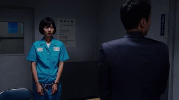 Movie still from “Sense8” (2015), directed by Tom Tykwer – A man in a blue suit and a woman in a blue suit; Medium shot, Over the shoulder angle