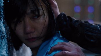 Movie still from “Sense8” (2015), directed by Tom Tykwer – A young woman is getting her hair brushed; Close Up shot, Over the shoulder angle