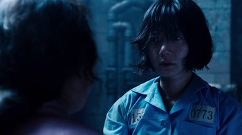 Movie still from “Sense8” (2015), directed by Tom Tykwer – A woman in a blue shirt is talking to another woman; Close Up shot, Over the shoulder angle
