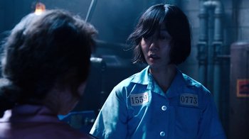 Movie still from “Sense8” (2015), directed by Tom Tykwer – A woman in a blue shirt is talking to another woman; Close Up shot, Over the shoulder angle