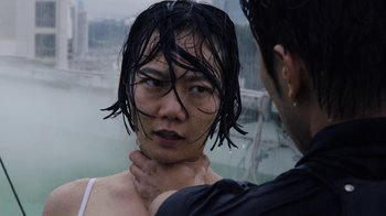 Movie still from “Sense8” (2015), directed by Tom Tykwer – A person with wet hair is standing next to another person with wet hair; Close Up shot, Over the shoulder angle